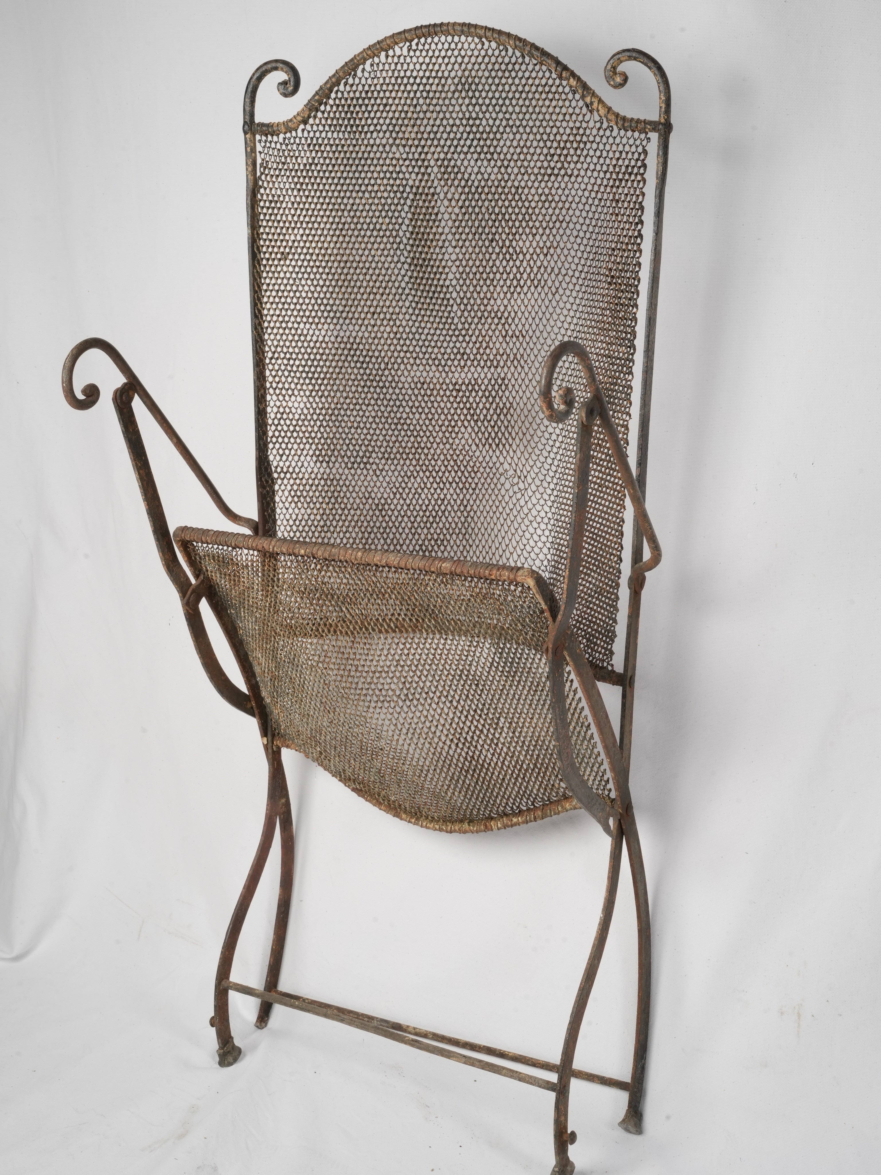 Textured patina wrought iron chair