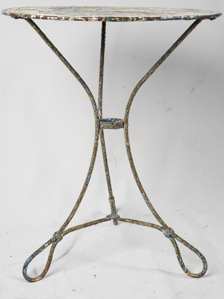 Elegant wrought iron tripod table