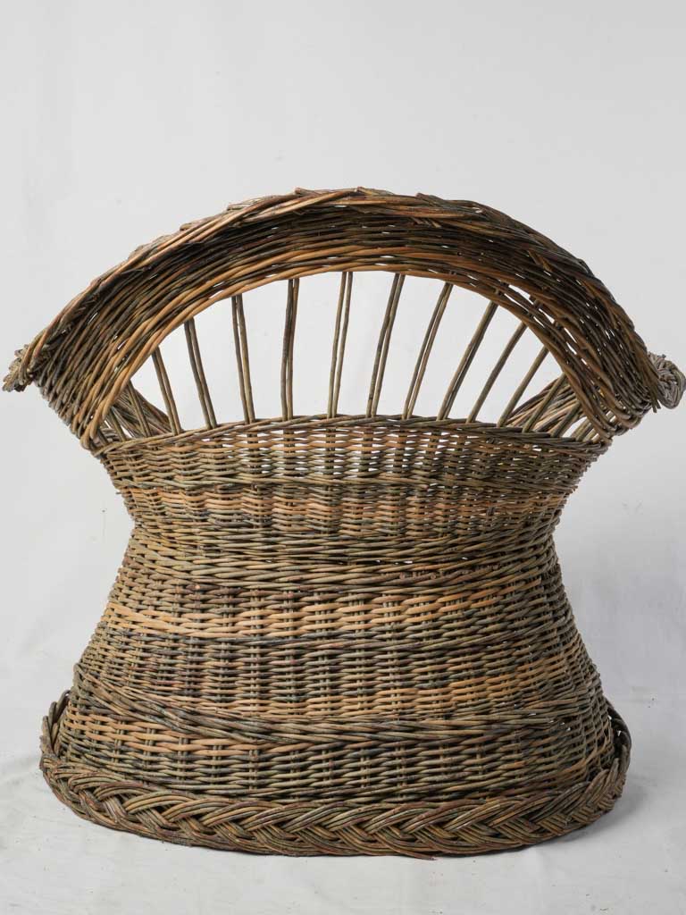 Low broad wicker armchair