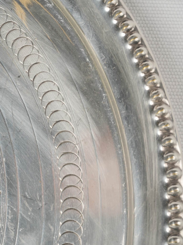 Delicate silver-plated engravings