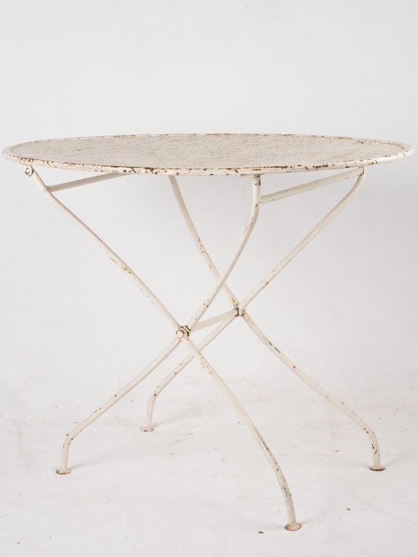Vintage white perforated metal garden table