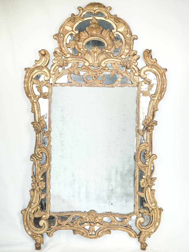 Antique opulent gilded mirror