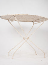 Shabby-chic oval outdoor iron table