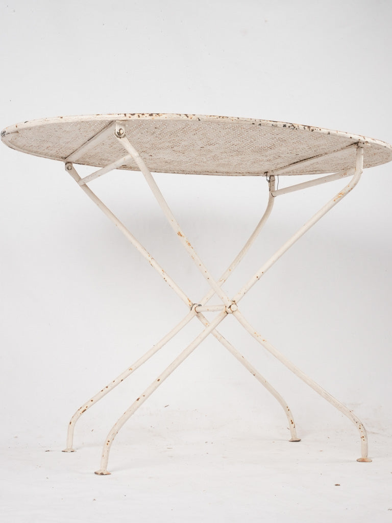Shabby-chic oval outdoor iron table