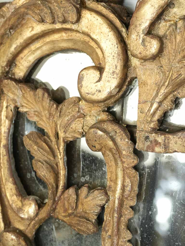 Richly carved acanthus leaves mirror