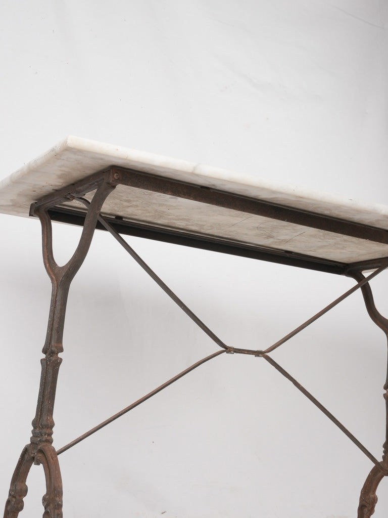 Decorative iron base outdoor table