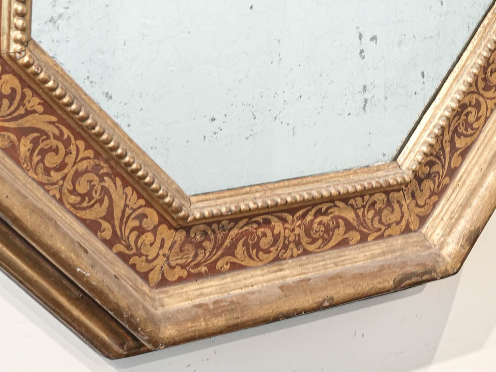 Warm-hued foliate motif mirror