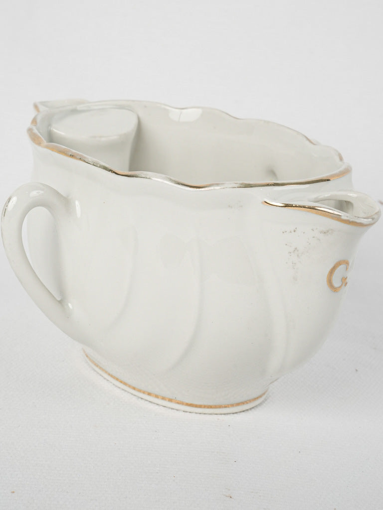 Rare, delicate double-sided gravy boat