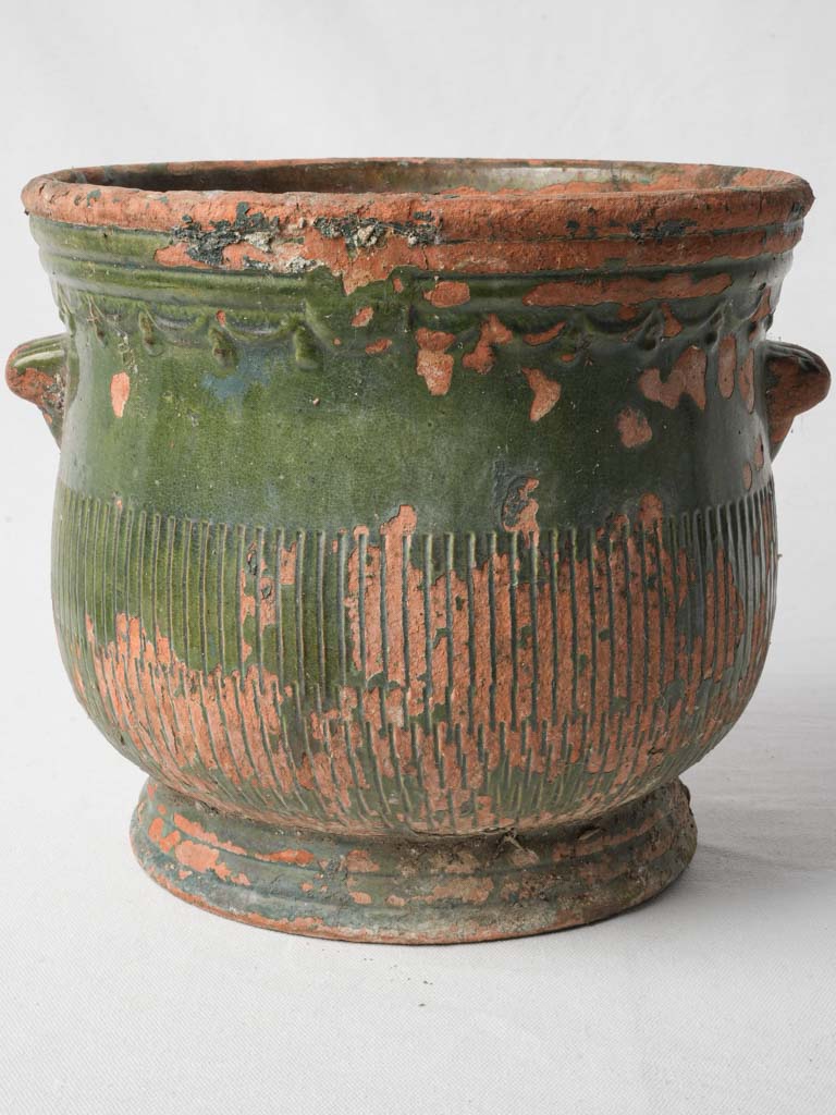 Distressed olive-glazed terracotta planter