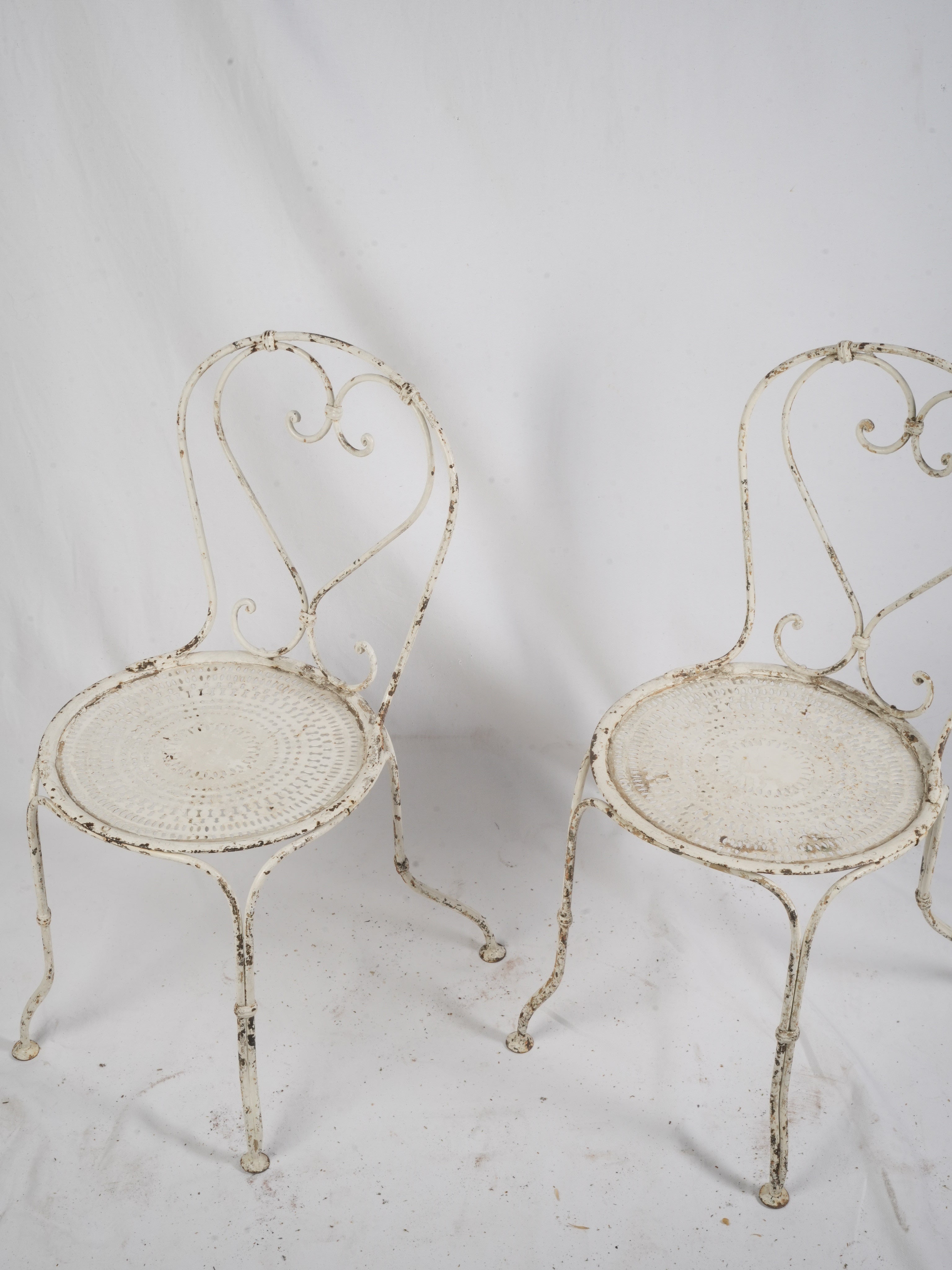 Delicate scrolled wrought iron seating
