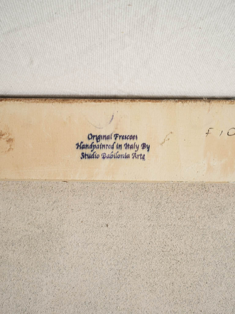 Intricate monogrammed fresco artwork