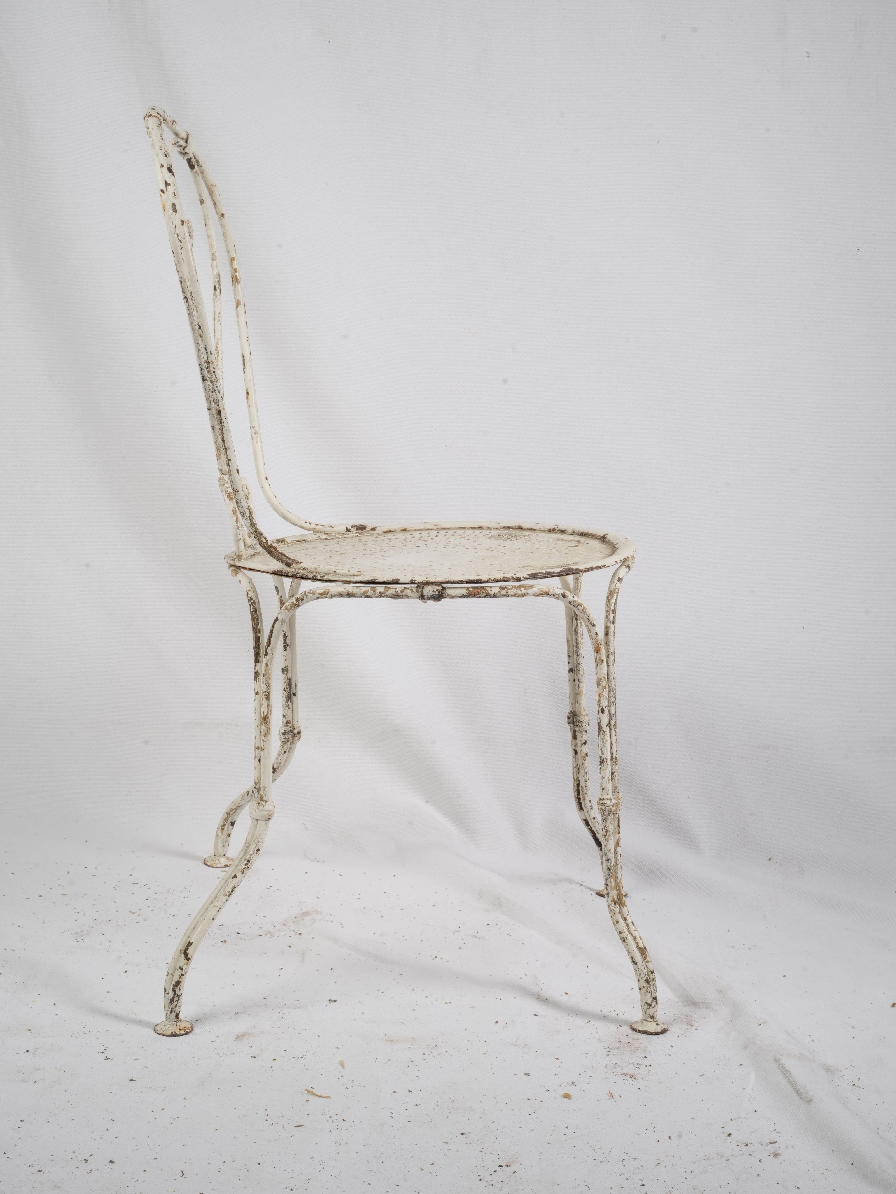 Pale white aged iron chairs set