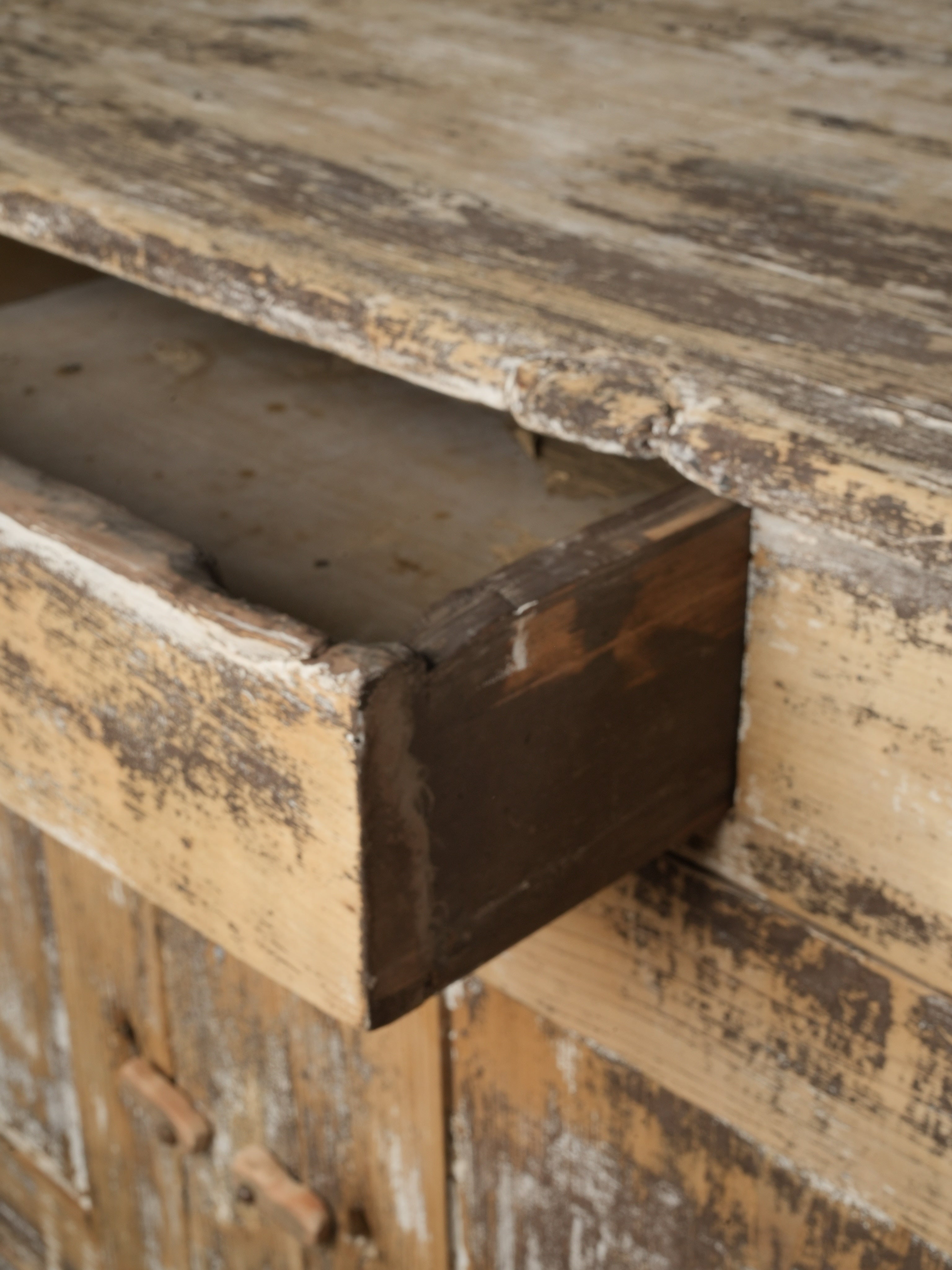 Mellow ochre-toned wooden sideboard