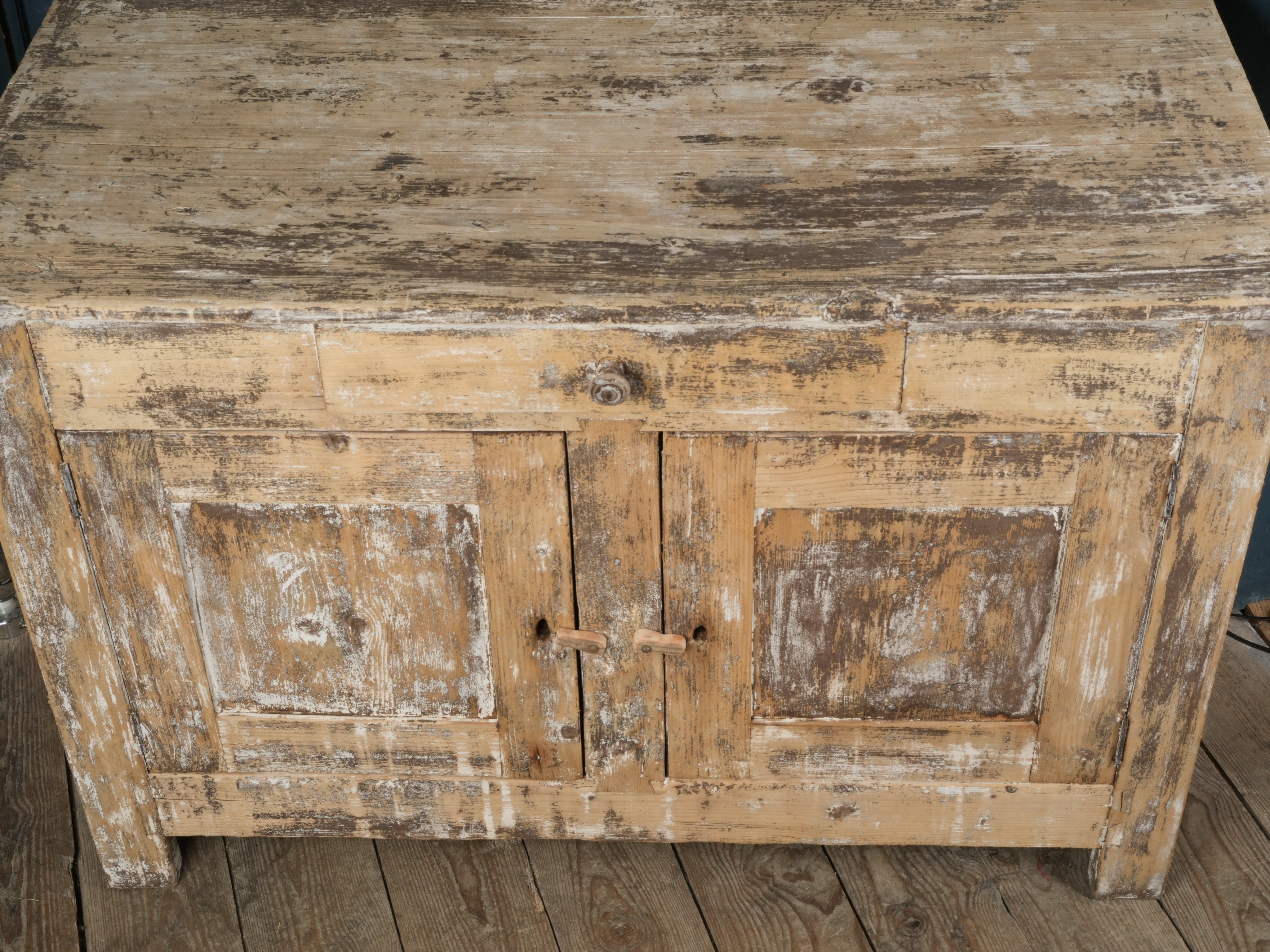 Patinated ochre-toned sideboard