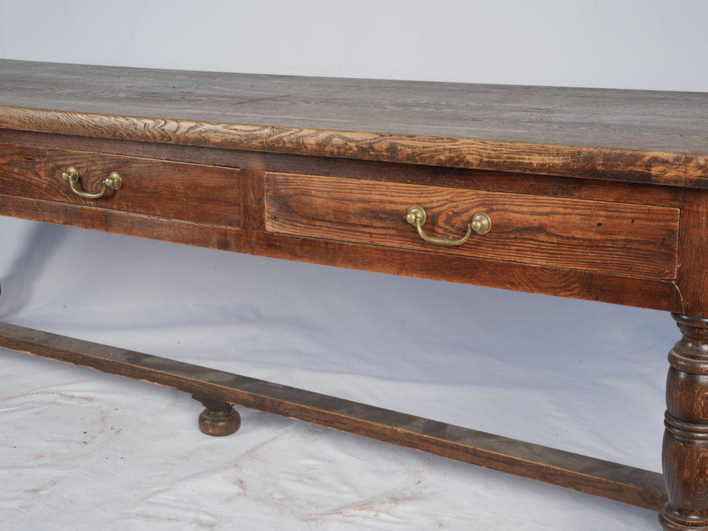 Dark patina French three-drawer console