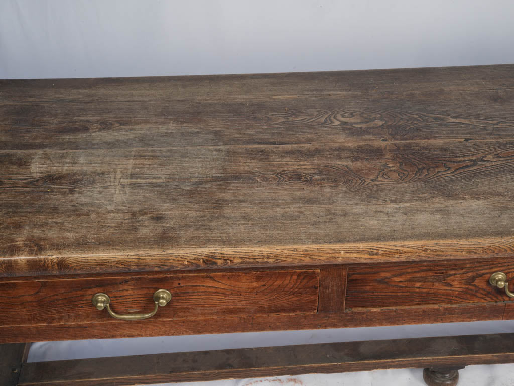 Dark patina three-drawer French console