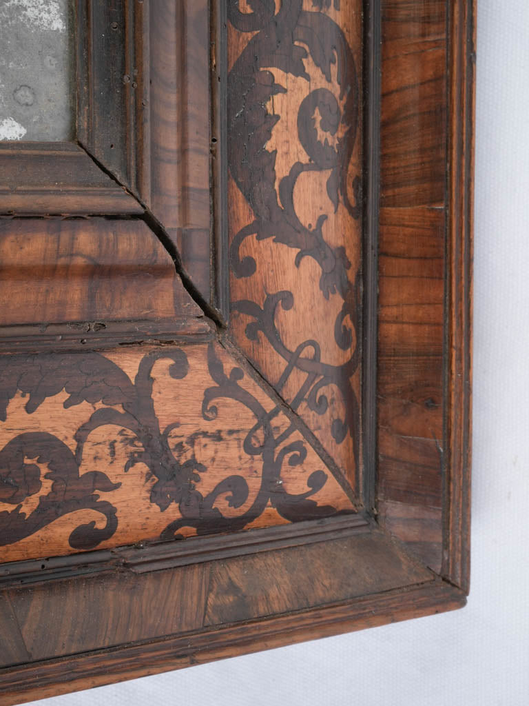 Decoratively inlaid walnut mirror