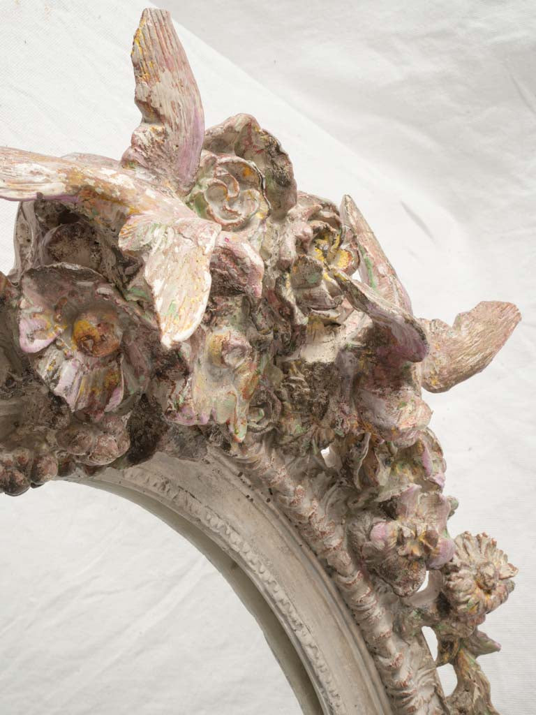 Pastel-toned floral crest mirror
