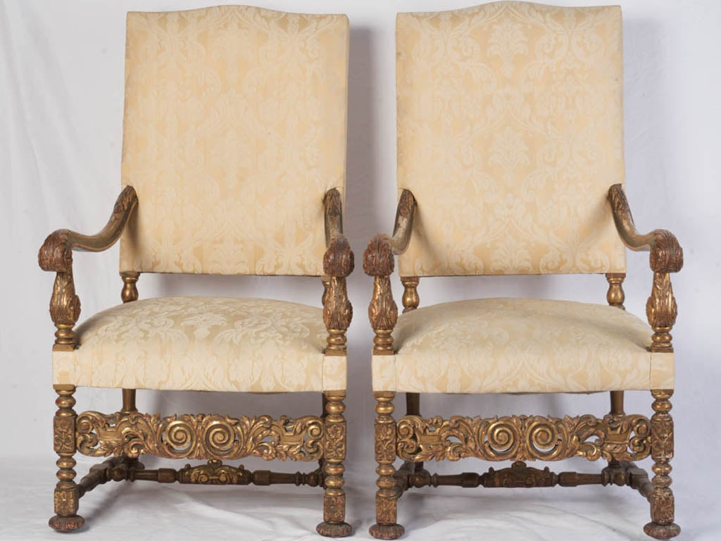 Richly carved giltwood armchairs