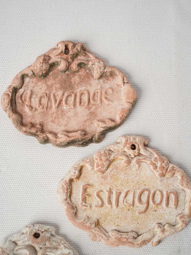 Weathered artisanal garden markers