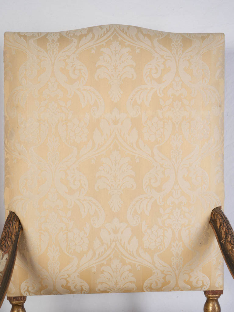 Sculptural scroll-arm armchairs