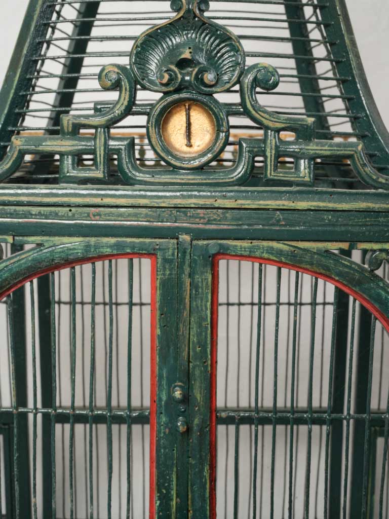 Detailed gilt-crested iron birdcage