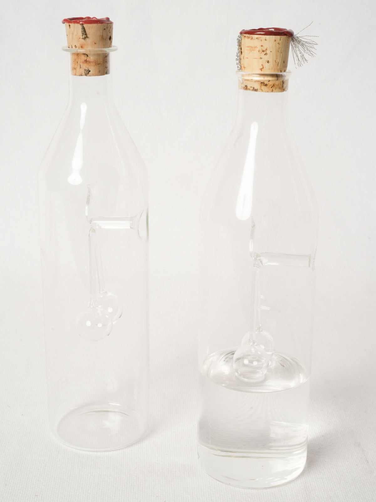 Pair of Swiss Blown Glass Kirsch Carafes with Cherry Sculpture