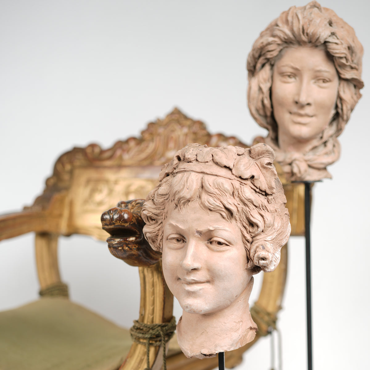 Earthen-toned sculptures, expressive terracotta