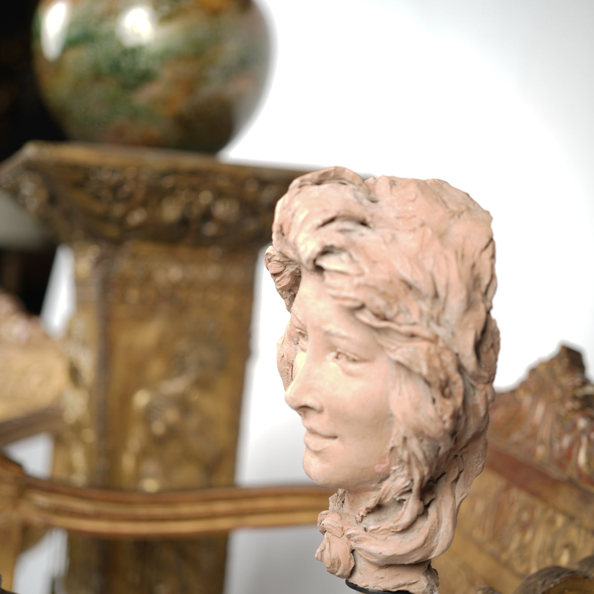 Terracotta busts on metal bases, collectible