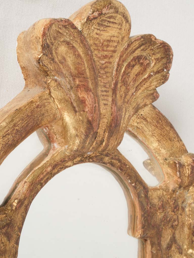 Richly gilded ornate framed mirror