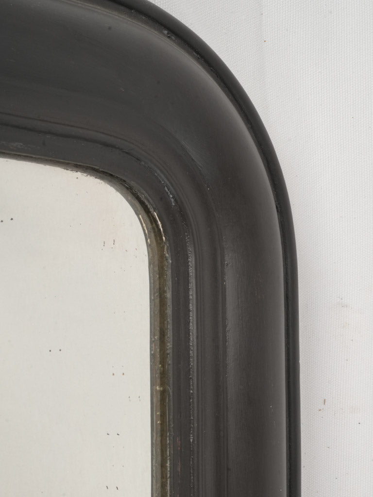 Black-framed mid-century elegant mirror