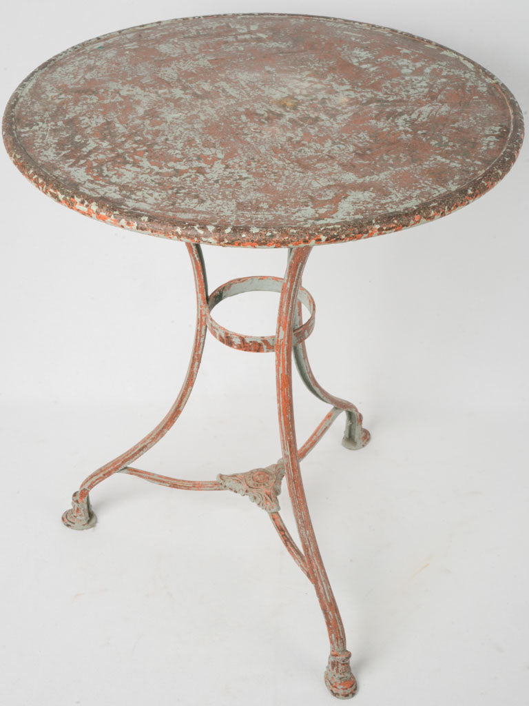 Green and red antique garden table