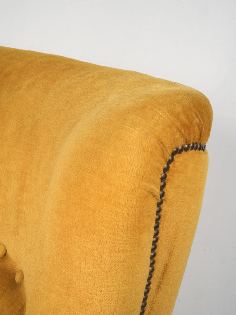 Comfortable feather-filled cushion armchair