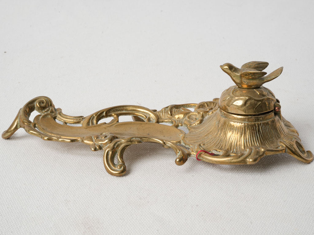 Asymmetrical scrolls design pen tray