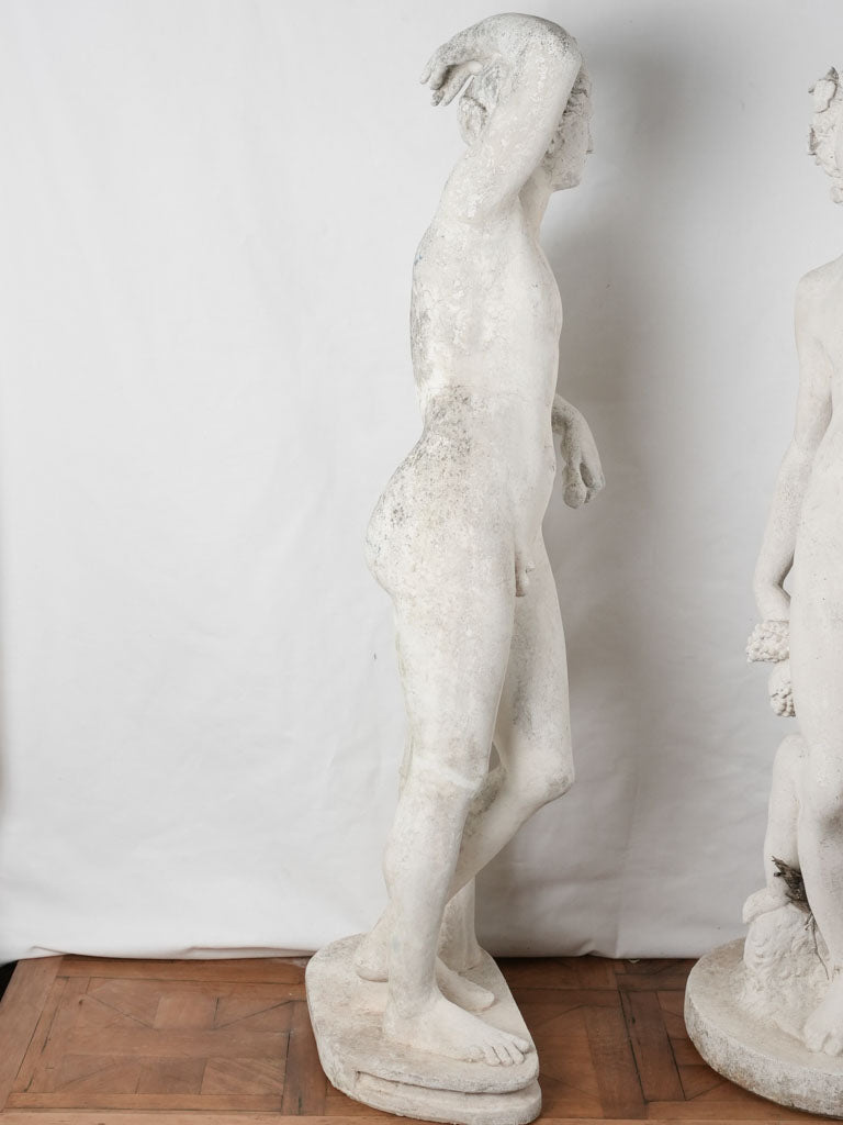 Elegant weathered concrete garden statues