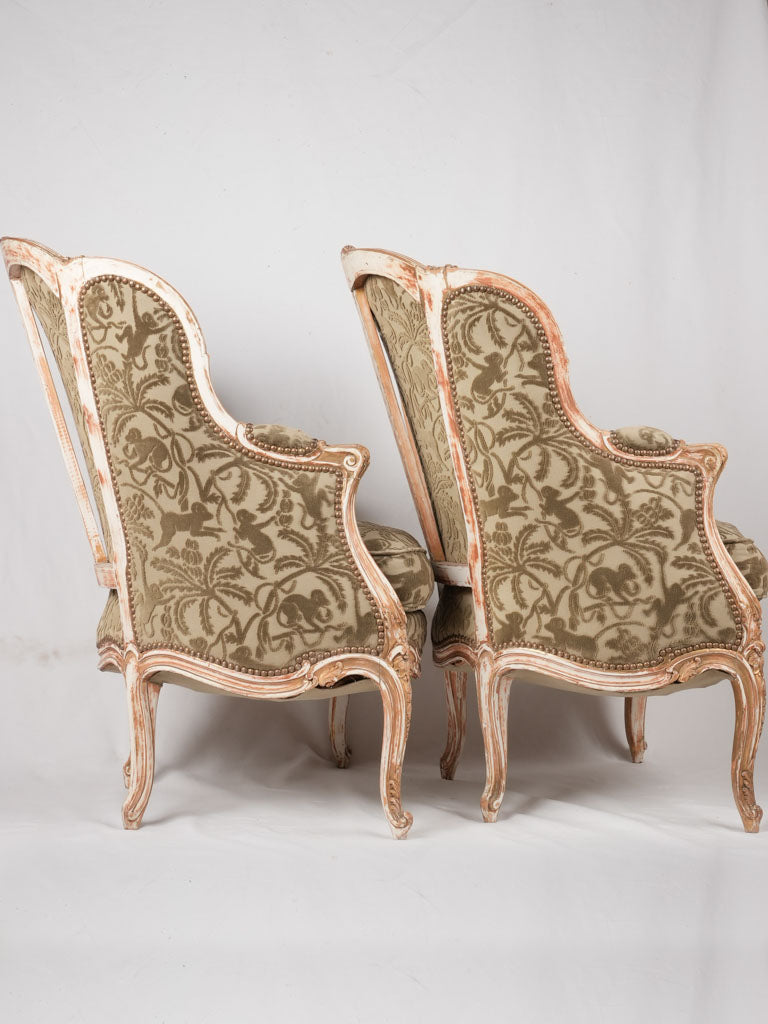 Ornate Louis XV carved armchairs