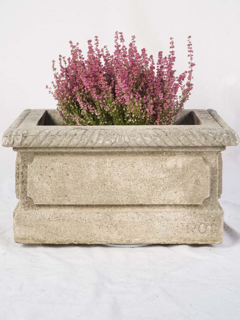 Timeless lichen-covered garden basin