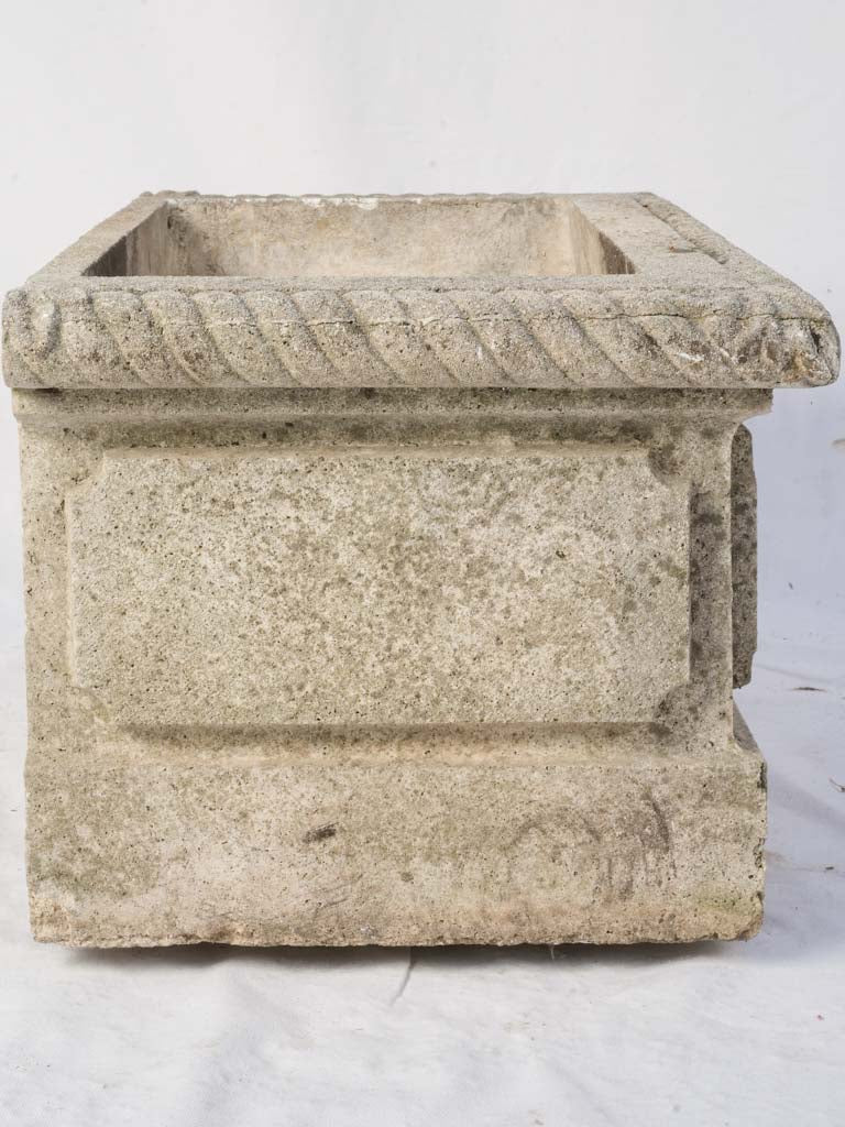 Classical moss-enriched stone trough
