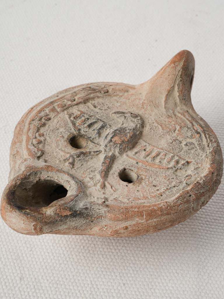Antique Carthaginian clay lamp artifact