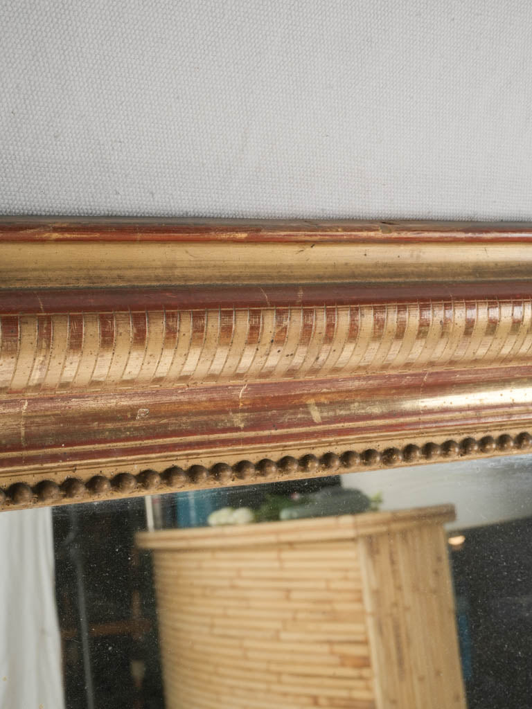 Gilt, striped frame wall mirror
