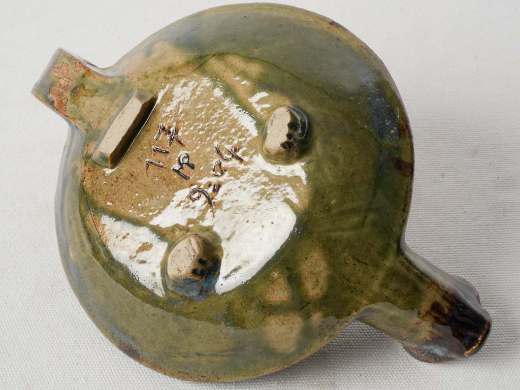 Engraved claw-like foot teapot  