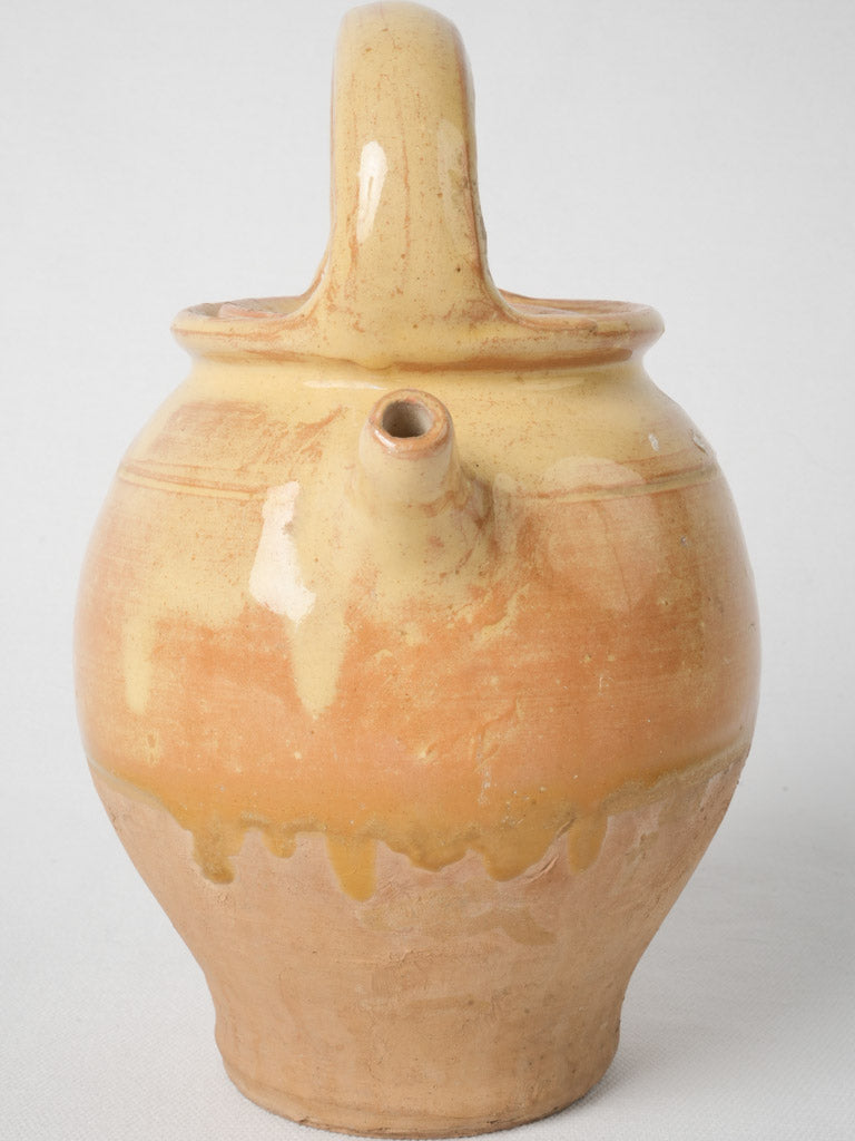 Mustard-colored antique pottery from France