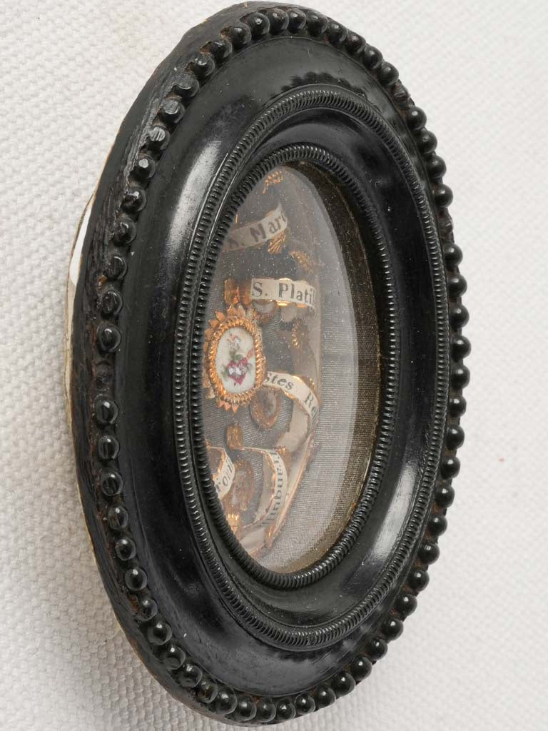 Intricate filigree sacred heart reliquary