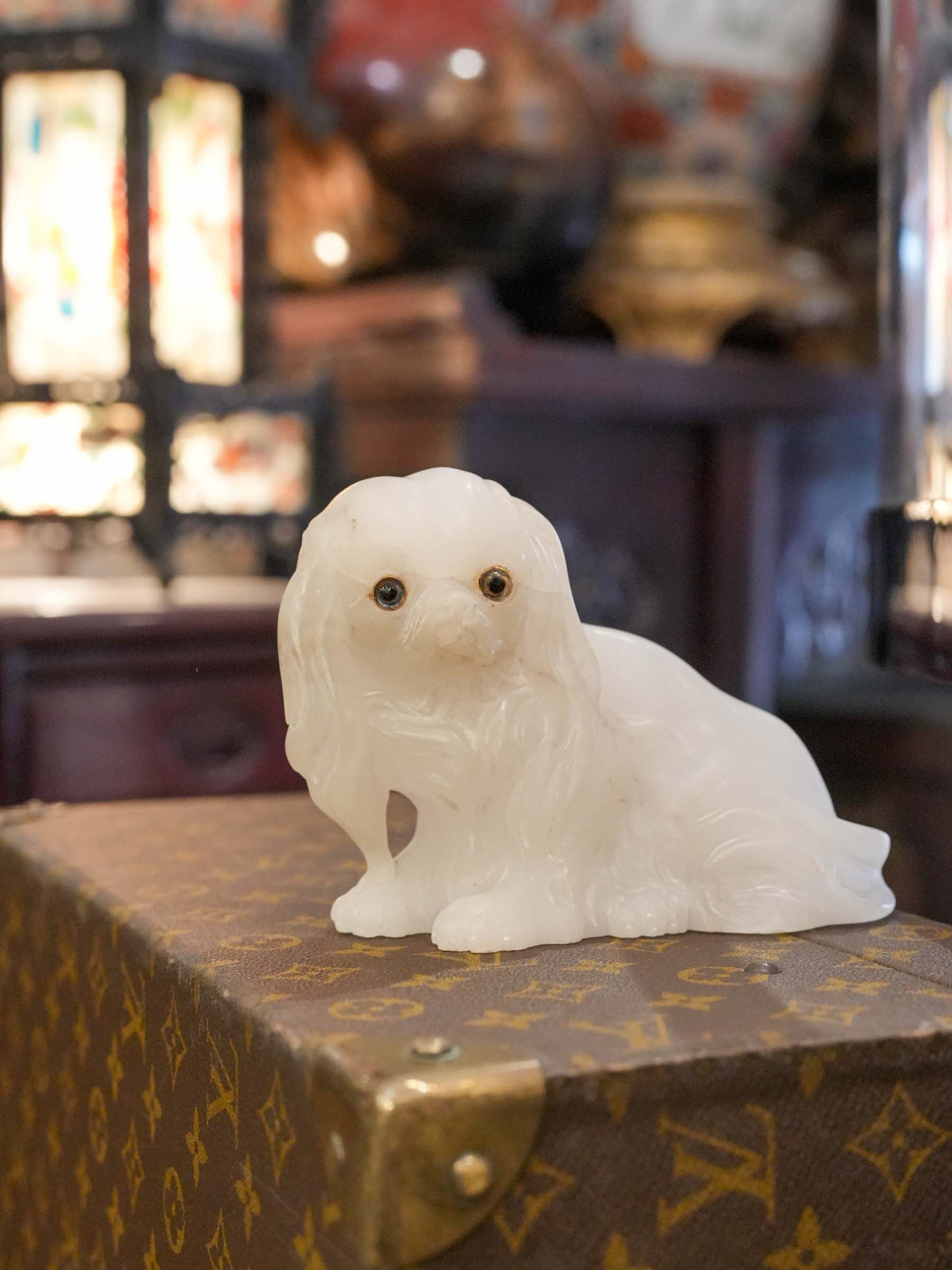 Expressive Pekingese sculpture with patina