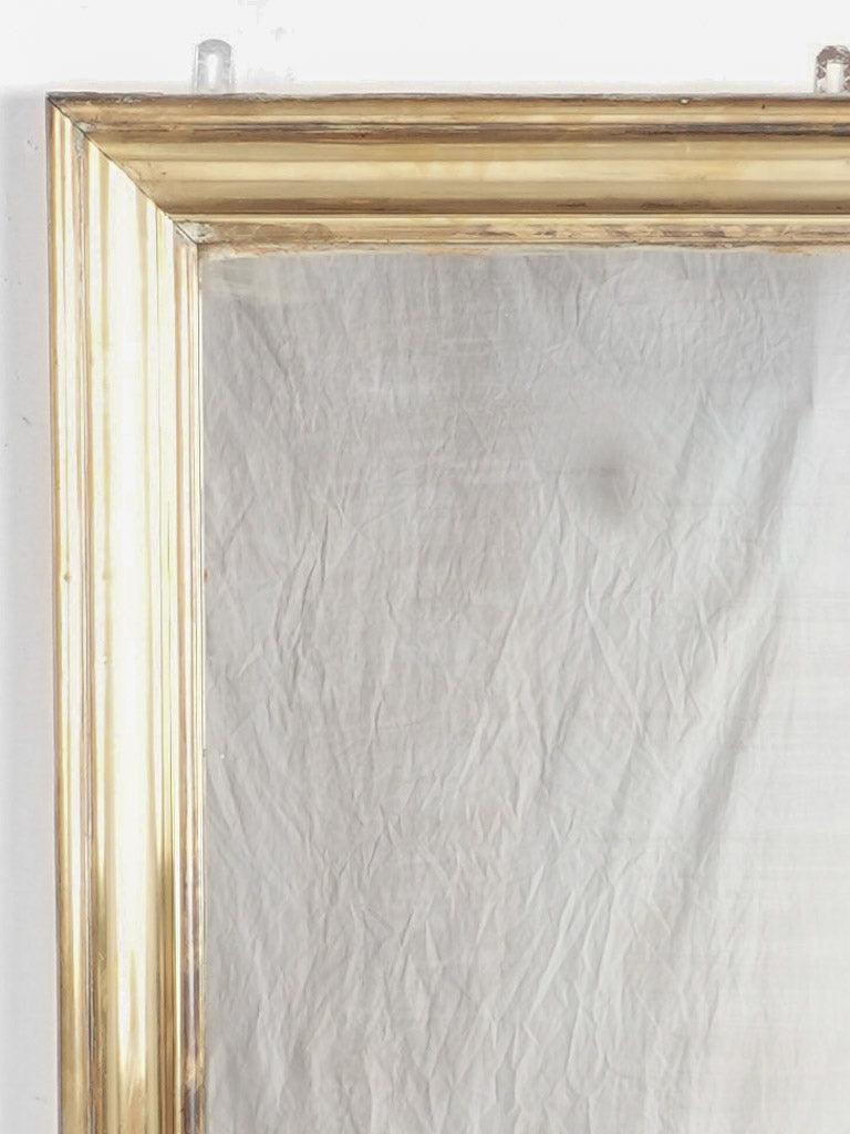 Vintage patinated brass framed mirror