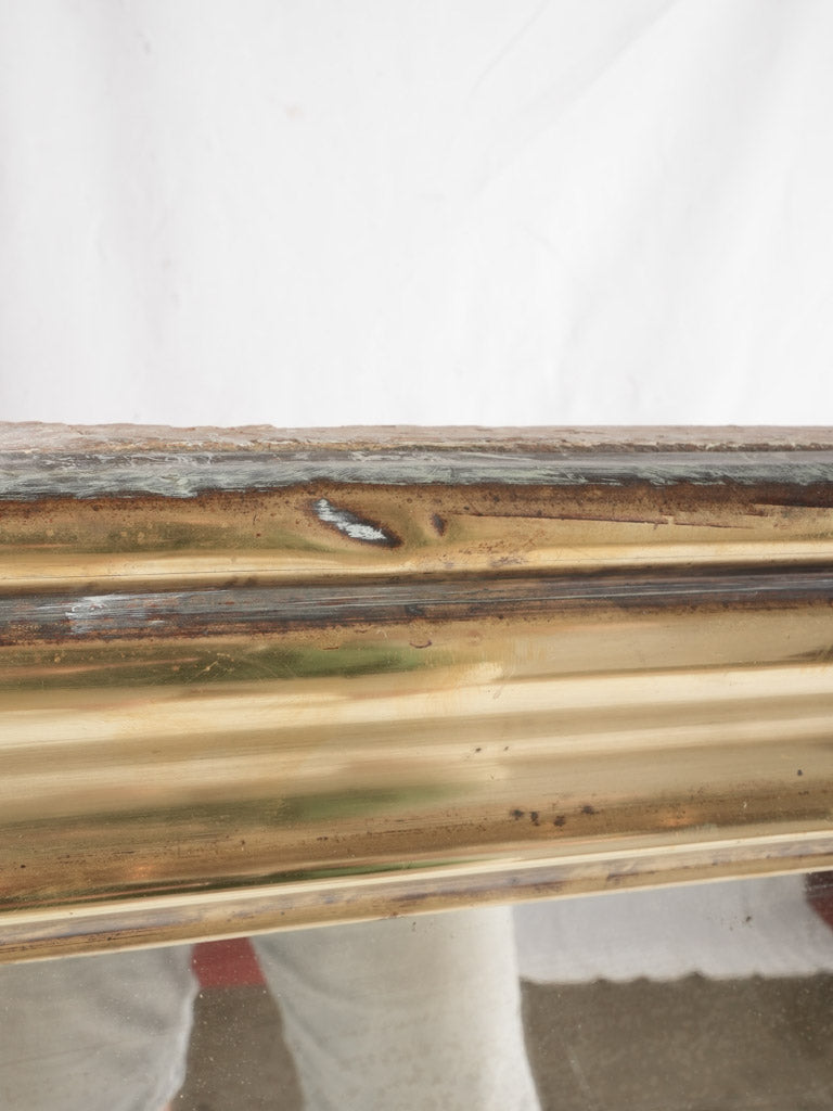 Ornate late 1800s brass mirror