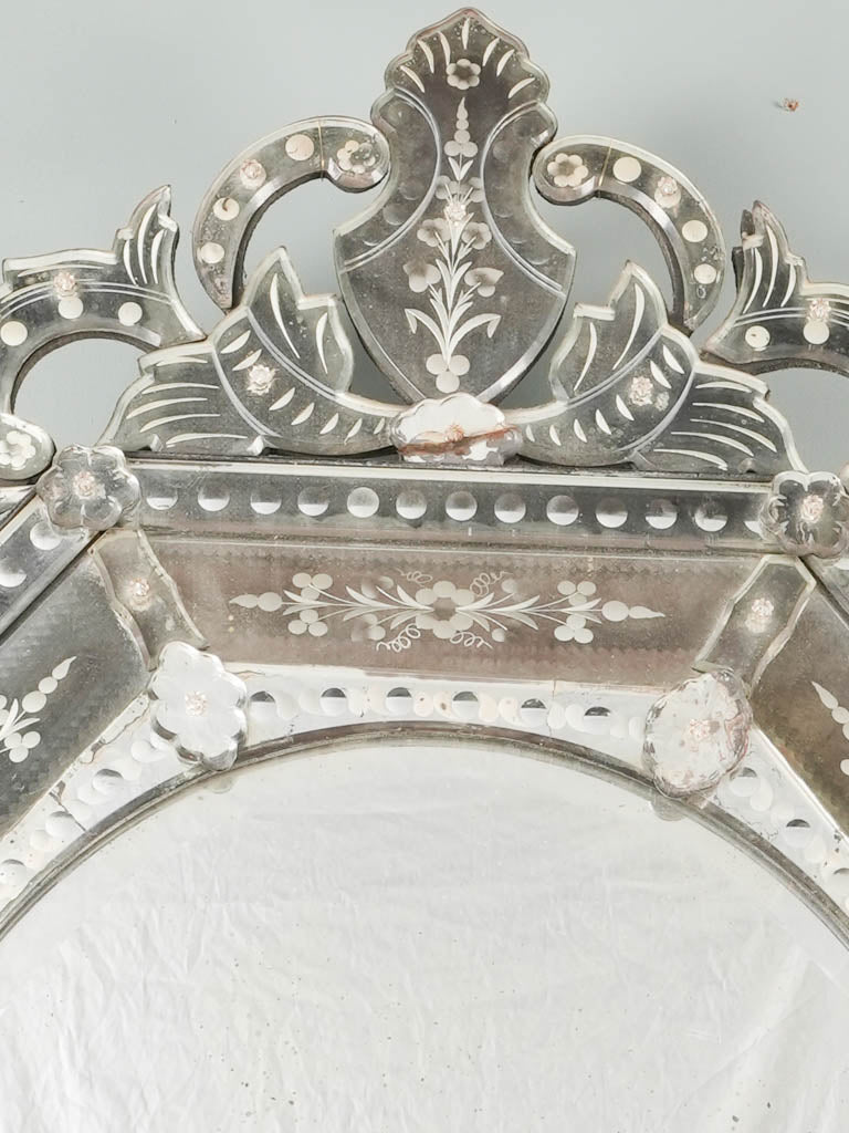 Vintage ornate mirror with floral accents