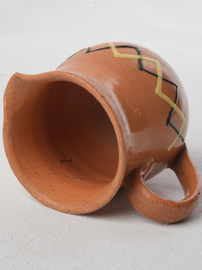 Timeworn alpine earthenware pitcher