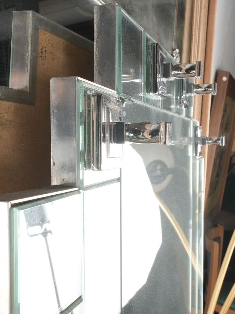 Antiqued mirrored surface hallway fixtures