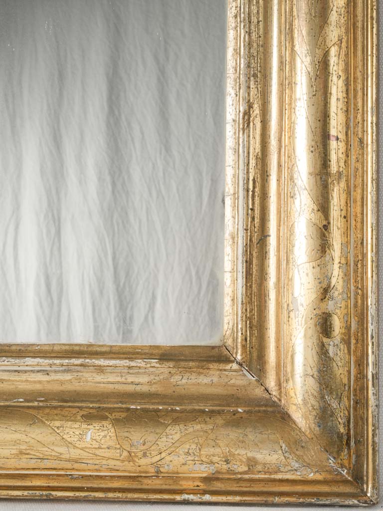 Timeless, gold-leaf French wall mirror